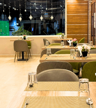 Elegant dining setup at Sharda Residency restaurant