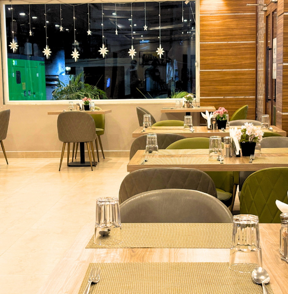 Cozy dining setup at Sharda Residency restaurant